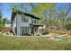 Backyard of a two-story home with a patio, chairs, and a retaining wall at 1010 Violet # A, Atlanta, GA 30310