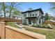 A landscaped backyard of a two-story home, with a patio and retaining wall at 1010 Violet # A, Atlanta, GA 30310