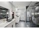 Luxurious Primary bathroom featuring double vanities, glass shower, and modern pendant lights at 1010 Violet # A, Atlanta, GA 30310