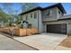 Two-story home with a modern design, a two-car garage, and a wooden fence at 1010 Violet # A, Atlanta, GA 30310