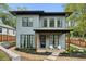 Charming two-story home with modern gray siding, black window trim, and inviting front porch area at 1010 Violet # A, Atlanta, GA 30310