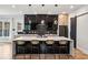 Modern kitchen featuring a large center island with seating, sleek cabinetry, and stylish pendant lighting at 1010 Violet # A, Atlanta, GA 30310
