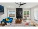 A living room featuring a marble fireplace, a ceiling fan, and hardwood floors at 1010 Violet # A, Atlanta, GA 30310