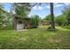 Exterior view of a brick house featuring a garage, spacious yard, and lush greenery at 2350 Maxine Se Dr, Marietta, GA 30067