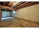Spacious unfinished basement featuring exposed beams and concrete flooring, awaiting personalization and finishing touches at 2350 Maxine Se Dr, Marietta, GA 30067