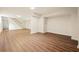 Basement featuring modern wood-look floors and white walls, offering a clean and spacious area at 2350 Maxine Se Dr, Marietta, GA 30067