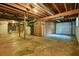 Large unfinished basement featuring garage access, exposed ceiling and concrete floor, great for storage at 2350 Maxine Se Dr, Marietta, GA 30067