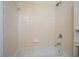 Bathroom featuring a tub and shower with a tiled surround and chrome hardware at 2350 Maxine Se Dr, Marietta, GA 30067