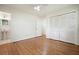 Bedroom with hardwood floors, closet, and a view to the adjacent bathroom at 2350 Maxine Se Dr, Marietta, GA 30067