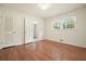 Cozy bedroom with hardwood floors, bright window, and convenient closet space at 2350 Maxine Se Dr, Marietta, GA 30067
