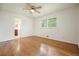 Bedroom with hardwood floors and a view to the adjacent bathroom and large window at 2350 Maxine Se Dr, Marietta, GA 30067