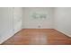 Bright bedroom featuring hardwood floors, a window, and a closet for ample storage at 2350 Maxine Se Dr, Marietta, GA 30067