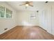 Bedroom with hardwood floors, bright windows, and closet with white paneled doors at 2350 Maxine Se Dr, Marietta, GA 30067