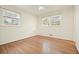 Bedroom with hardwood floors and dual windows allowing for ample natural light at 2350 Maxine Se Dr, Marietta, GA 30067