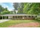 Charming brick home with a covered carport and manicured lawn, perfect for suburban living at 2350 Maxine Se Dr, Marietta, GA 30067