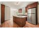 Open kitchen featuring a large island with granite countertops and stainless steel appliances at 2350 Maxine Se Dr, Marietta, GA 30067