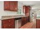 Charming kitchen with wood cabinets, granite counters, and stainless steel dishwasher at 2350 Maxine Se Dr, Marietta, GA 30067