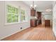 Charming kitchen with granite counters, wood cabinets, stainless appliances, and sunlit view to yard at 2350 Maxine Se Dr, Marietta, GA 30067