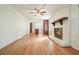 Bright open-concept living room featuring a fireplace, hardwood floors, and kitchen at 2350 Maxine Se Dr, Marietta, GA 30067
