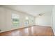Large living space with hardwood floors, white walls, and lots of windows at 2350 Maxine Se Dr, Marietta, GA 30067