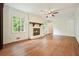 Inviting living room with a brick fireplace, hardwood floors, and natural light at 2350 Maxine Se Dr, Marietta, GA 30067