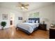 Comfortable main bedroom with ensuite bathroom, hardwood floors, and plenty of natural light at 2350 Maxine Se Dr, Marietta, GA 30067