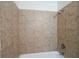 A close-up of the shower features light brown tiling at 2350 Maxine Se Dr, Marietta, GA 30067