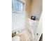 This bathroom has built-in drawer storage next to the toilet, with a window bringing in natural light at 3701 Shallowford Rd, Marietta, GA 30062