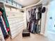 Walk-in closet with shelving and drawers, and a rod for hanging clothes at 3701 Shallowford Rd, Marietta, GA 30062