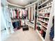 Walk-in closet with ample storage, including rods for hanging clothes and shelves for shoes and accessories at 3701 Shallowford Rd, Marietta, GA 30062