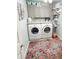 Laundry room features modern appliances, storage cabinets, and shelving at 3701 Shallowford Rd, Marietta, GA 30062