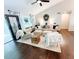 Cozy living room featuring hardwood floors, ample seating, and abundant natural light at 3701 Shallowford Rd, Marietta, GA 30062