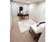 Office features a beautiful rug, desk, and chair, with lots of natural light at 3701 Shallowford Rd, Marietta, GA 30062