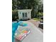 Backyard pool and cabana with a variety of colorful pool floats at 3701 Shallowford Rd, Marietta, GA 30062