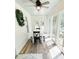 Inviting sunroom with natural light, white table, seating, and views of lush greenery at 3701 Shallowford Rd, Marietta, GA 30062