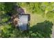 An aerial shot of the house, including its lush yard and shaded patio at 3812 Stonewall Nw Dr, Kennesaw, GA 30152