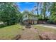 View of the backyard showing the firepit and entrance to the basement garage at 3812 Stonewall Nw Dr, Kennesaw, GA 30152
