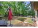 Wide backyard with a wood deck and outdoor grill at 3812 Stonewall Nw Dr, Kennesaw, GA 30152