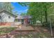 A shot of the backyard featuring a wood deck and patio furniture at 3812 Stonewall Nw Dr, Kennesaw, GA 30152