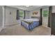 Bedroom with neutral walls, carpeted floors, ceiling fan, and windows providing natural light at 3812 Stonewall Nw Dr, Kennesaw, GA 30152