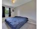 Cozy bedroom with neutral walls, carpeted floors, and a window providing natural light at 3812 Stonewall Nw Dr, Kennesaw, GA 30152