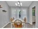 Bright dining room with hardwood floors and a modern chandelier at 3812 Stonewall Nw Dr, Kennesaw, GA 30152