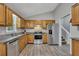 Spacious kitchen with stainless steel appliances, wood cabinets, and granite countertops at 3812 Stonewall Nw Dr, Kennesaw, GA 30152