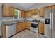 Spacious kitchen with stainless steel appliances, wood cabinets, and granite countertops at 3812 Stonewall Nw Dr, Kennesaw, GA 30152