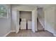 Convenient laundry room featuring a washer and dryer inside of a closet near the staircase at 3812 Stonewall Nw Dr, Kennesaw, GA 30152
