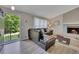 Inviting living room with a fireplace, ample natural light, and hardwood floors at 3812 Stonewall Nw Dr, Kennesaw, GA 30152