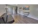 Spacious living room with wood-look flooring and neutral walls with stairway and closet views at 3812 Stonewall Nw Dr, Kennesaw, GA 30152