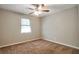 Bedroom features neutral walls, carpet, and one window at 5379 Winslow Xing, Lithonia, GA 30038