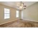 Bedroom features neutral walls, carpet, and one window at 5379 Winslow Xing, Lithonia, GA 30038