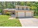 Well-maintained two story home with a 2 car garage and an inviting front lawn at 5379 Winslow Xing, Lithonia, GA 30038